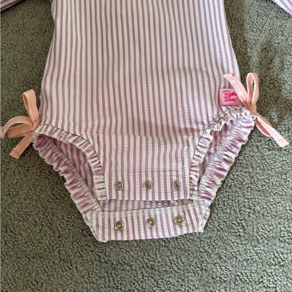 Ruffle Butts Purple and White Striped Swimsuit with Bow Details - Picture 2 of 7